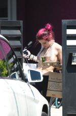 BELLA THORNE in Bikini Top Picks Up Her Delivery from Juice Crafters 08/05/2017