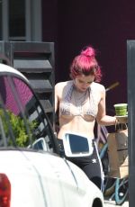BELLA THORNE in Bikini Top Picks Up Her Delivery from Juice Crafters 08/05/2017