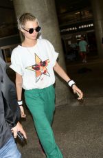 CARA DELEVINGNE at LAX Airport in Los Angeles 08/28/2017