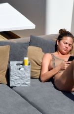 CHRISSY TEIGEN in Swimsuit at a Boat in Corsica 08/28/2017