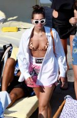 DUA LIPA Sunbathing at a Beach in Capri 08/29/2017