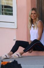 ELYSE KNOWLES on the Set of a Photoshoot for Ugg Shoes at Bondi Beach 08/28/2017