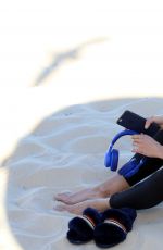ELYSE KNOWLES on the Set of a Photoshoot for Ugg Shoes at Bondi Beach 08/28/2017