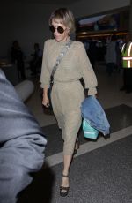 KRISTEN WIIG at Los Angeles International Airport 08/24/2017