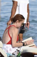 LINDSAY LOHAN in Swimsuit at Nammos Beach in Mykonos 08/21/2017