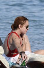 LINDSAY LOHAN in Swimsuit at Nammos Beach in Mykonos 08/21/2017