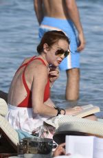LINDSAY LOHAN in Swimsuit at Nammos Beach in Mykonos 08/21/2017