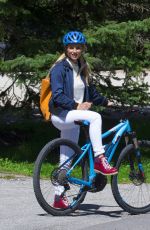 MICHELLE HUNZIKER Out Riding a Bike in San Cassiano in Badia 08/13/2017
