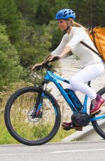 MICHELLE HUNZIKER Out Riding a Bike in San Cassiano in Badia 08/13/2017