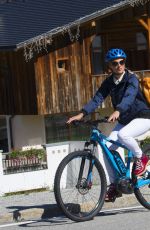 MICHELLE HUNZIKER Out Riding a Bike in San Cassiano in Badia 08/13/2017