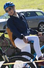 MICHELLE HUNZIKER Out Riding a Bike in San Cassiano in Badia 08/13/2017