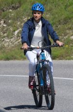 MICHELLE HUNZIKER Out Riding a Bike in San Cassiano in Badia 08/13/2017