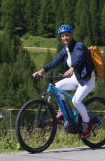 MICHELLE HUNZIKER Out Riding a Bike in San Cassiano in Badia 08/13/2017