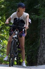 MICHELLE HUNZIKER Ridig a Bicycle Out in Bergamo 08/05/2017