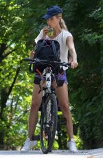 MICHELLE HUNZIKER Ridig a Bicycle Out in Bergamo 08/05/2017