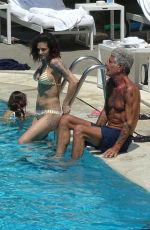ASIA ARGENTO in Bikini and Anthony Bourdain at a Pool in Rome 09/20/2017