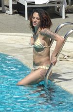 ASIA ARGENTO in Bikini and Anthony Bourdain at a Pool in Rome 09/20/2017