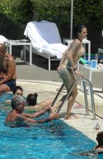 ASIA ARGENTO in Bikini and Anthony Bourdain at a Pool in Rome 09/20/2017