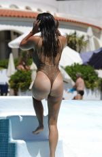 CASEY BATCHELOR and FRANKIE ESSEX in Swimsuits at a Pool in Spain 09/18/2017