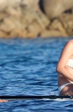 CHRISSY TEIGEN in Bikini at a Boat in Sardinia 08/30/2017