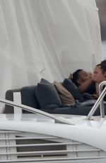 CHRISSY TEIGEN in Bikini at a Yacht in Sardinia 08/31/2017