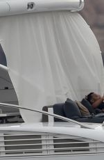 CHRISSY TEIGEN in Bikini at a Yacht in Sardinia 08/31/2017