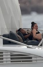 CHRISSY TEIGEN in Bikini at a Yacht in Sardinia 08/31/2017