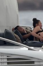CHRISSY TEIGEN in Bikini at a Yacht in Sardinia 08/31/2017