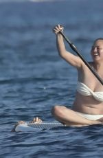 CHRISSY TEIGEN Paddleboarding in Sardinia 08/30/2017