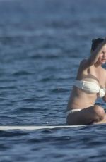 CHRISSY TEIGEN Paddleboarding in Sardinia 08/30/2017