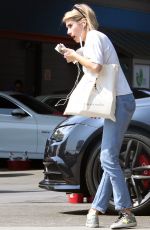 EMMA ROBERTS Having Her Car Washed in Los Angeles 09/26/2017