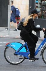 PARIS HILTON and Chris Zylka Riding Bicycles Out in New York 09/17/2017