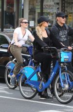 PARIS HILTON and Chris Zylka Riding Bicycles Out in New York 09/17/2017