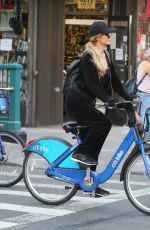 PARIS HILTON and Chris Zylka Riding Bicycles Out in New York 09/17/2017