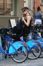 PARIS HILTON and Chris Zylka Riding Bicycles Out in New York 09/17/2017