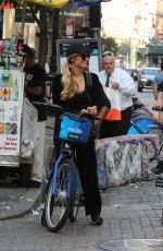 PARIS HILTON and Chris Zylka Riding Bicycles Out in New York 09/17/2017