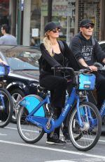 PARIS HILTON and Chris Zylka Riding Bicycles Out in New York 09/17/2017