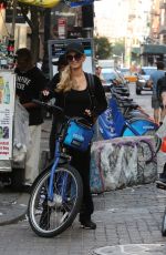 PARIS HILTON and Chris Zylka Riding Bicycles Out in New York 09/17/2017