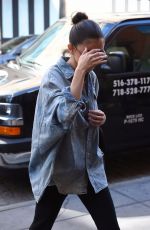 SELENA GOMEZ in Oversized Denim Shirt Out in New York 09/27/2017