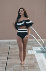 YAZMIN OUKHELLOU in Swimsuit at a Pool in Marbella 09/13/2017