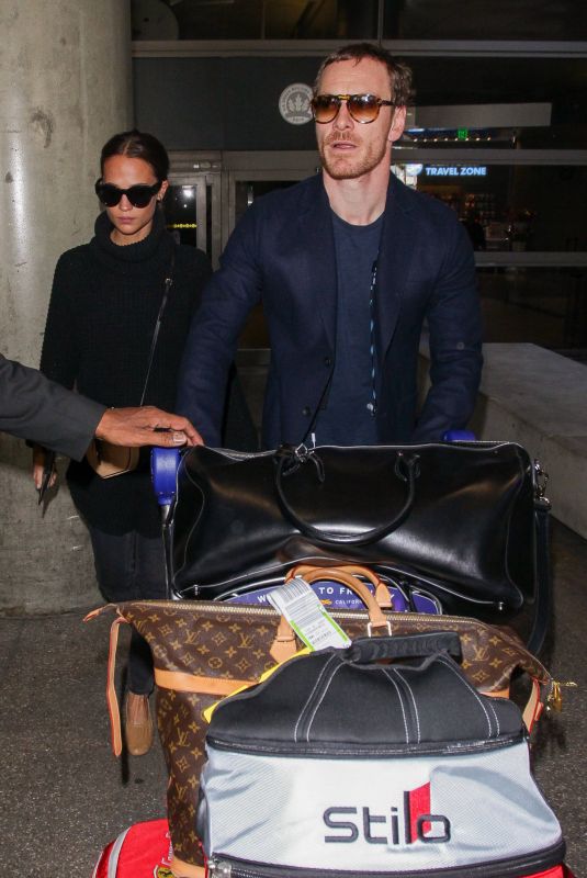 ALICIA VIKANDER and Michael Fassbender at LAX Airport in Los Angeles 10/04/2017