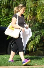 AMY POEHLER Arrives at a Friend