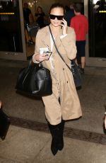 CHRISSY TEIGEN at LAX Airport in Los Angeles 10/06/2017