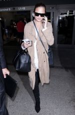 CHRISSY TEIGEN at LAX Airport in Los Angeles 10/06/2017