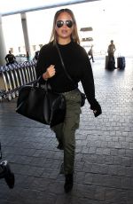 CHRISSY TEIGEN at Los Angeles International Airport 10/02/2017