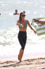 ELLE MACPHERSON in Bikini Top and Leggings at a Beach in Miami 10/13/2017