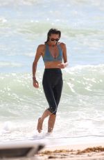 ELLE MACPHERSON in Bikini Top and Leggings at a Beach in Miami 10/13/2017