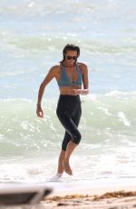 ELLE MACPHERSON in Bikini Top and Leggings at a Beach in Miami 10/13/2017