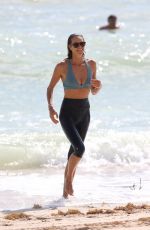 ELLE MACPHERSON in Bikini Top and Leggings at a Beach in Miami 10/13/2017
