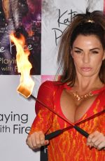KATIE PRICE Fire Breathing at Her New Book Playing with Fire Photocall in London 01/17/2017